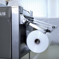 Bobine inférieure avec bras tendeur